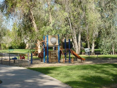 Playground shaded by trees